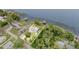 Aerial view of the stunning waterfront property, nestled amongst lush greenery, and offering breathtaking lake views at 1149 Shady Cove E Rd, Haines City, FL 33844