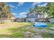 Lovely home with a spacious backyard and a large detached garage, offering plenty of room for outdoor activities and storage at 1149 Shady Cove E Rd, Haines City, FL 33844