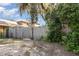 Fenced backyard with lush greenery offers privacy and security, creating a peaceful and enjoyable outdoor space at 1149 Shady Cove E Rd, Haines City, FL 33844