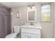 Updated bathroom features a new vanity, quartz countertop, shower, and natural light at 1149 Shady Cove E Rd, Haines City, FL 33844