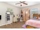 Cozy bedroom with carpet, bed, desk, bookcase, and dresser storage at 1149 Shady Cove E Rd, Haines City, FL 33844