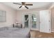 Bright bedroom with ceiling fan and exterior access door to deck with water view at 1149 Shady Cove E Rd, Haines City, FL 33844