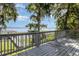 Waterfront home features a deck with a beautiful view of the lake and private dock, perfect for relaxing and entertaining at 1149 Shady Cove E Rd, Haines City, FL 33844