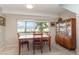 Dining room boasts scenic water view windows and comfortable seating for Gathering meals at 1149 Shady Cove E Rd, Haines City, FL 33844