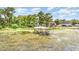 View of a covered dock on the water surrounded by vegetation at 1149 Shady Cove E Rd, Haines City, FL 33844