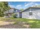 Charming home with a spacious backyard, lovely patio, and lush greenery, perfect for outdoor entertaining and relaxation at 1149 Shady Cove E Rd, Haines City, FL 33844
