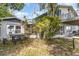 View of the exterior of a single-Gathering home with a patio table and chairs at 1149 Shady Cove E Rd, Haines City, FL 33844