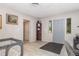Inviting foyer with tile flooring, a gray door, and access to other living areas at 1149 Shady Cove E Rd, Haines City, FL 33844