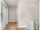 Bright hallway features neutral walls, plush carpet and natural light from exterior doors at 1149 Shady Cove E Rd, Haines City, FL 33844