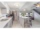 Modern kitchen features white cabinets, breakfast bar and views of the lake at 1149 Shady Cove E Rd, Haines City, FL 33844