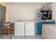 Utility room with stacked washer, dryer, and storage at 1149 Shady Cove E Rd, Haines City, FL 33844