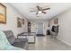 Cozy living room with tile floors, ceiling fan and access to the front door at 1149 Shady Cove E Rd, Haines City, FL 33844