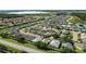 Aerial view of a community with a lake and well-manicured landscapes at 2925 Dayton Dr, Winter Haven, FL 33884