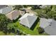 Aerial view of a home with a well-maintained roof, backyard, and green lawn at 2925 Dayton Dr, Winter Haven, FL 33884