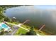 Aerial view of lake showing multiple docks and swimming pool at 2925 Dayton Dr, Winter Haven, FL 33884
