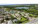 Aerial view of a lakeside community showcasing houses and lush greenery at 2925 Dayton Dr, Winter Haven, FL 33884
