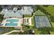 Aerial view featuring community amenities including a pool, sports courts, and clubhouse at 2925 Dayton Dr, Winter Haven, FL 33884
