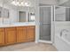 Bathroom features a large vanity with double sinks, shower, and bathtub with tile accents at 2925 Dayton Dr, Winter Haven, FL 33884