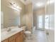 Well-lit bathroom with a single sink vanity, tile flooring, and a shower-tub combination at 2925 Dayton Dr, Winter Haven, FL 33884
