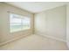 Bedroom with carpet, blinds, and natural light at 2925 Dayton Dr, Winter Haven, FL 33884