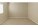 A simple bedroom with a window, carpet, and neutral paint at 2925 Dayton Dr, Winter Haven, FL 33884