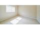 Bright bedroom featuring neutral walls, carpet, and a window allowing natural light at 2925 Dayton Dr, Winter Haven, FL 33884