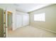 Cozy bedroom featuring double closets and a window for natural light at 2925 Dayton Dr, Winter Haven, FL 33884