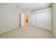 Bedroom with double closets and view to an ensuite bathroom at 2925 Dayton Dr, Winter Haven, FL 33884