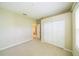 Spacious bedroom features double closets and a view to the laundry room at 2925 Dayton Dr, Winter Haven, FL 33884