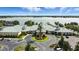An aerial view of a lakeside clubhouse with inviting landscaping and parking at 2925 Dayton Dr, Winter Haven, FL 33884