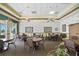 Inviting common area with tables, chairs, floral wallpaper and plenty of natural light at 2925 Dayton Dr, Winter Haven, FL 33884