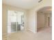 Spacious living area with neutral carpet, sliding glass doors to the patio, and an arched entryway at 2925 Dayton Dr, Winter Haven, FL 33884