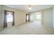 Large main bedroom features carpet, neutral tones, and a view of the bathroom at 2925 Dayton Dr, Winter Haven, FL 33884