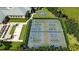 Aerial view showcasing community tennis and sports courts, bocce ball and shuffleboard at 2925 Dayton Dr, Winter Haven, FL 33884
