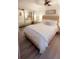 Beautiful bedroom featuring a plush bed, mirrored closet doors, and a warm, inviting ambiance at 4733 Club Cir, Lakeshore, FL 33854