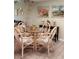 Inviting dining area with a glass-top table and seating for six, perfect for gatherings at 4733 Club Cir, Lakeshore, FL 33854