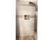 Modern shower with pebble floor, luxurious showerhead, and stylish tile accents at 4733 Club Cir, Lakeshore, FL 33854
