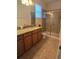 Bathroom featuring granite countertops, a shower, and a toilet at 8923 Cuban Palm Rd, Kissimmee, FL 34747