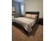 Cozy bedroom with a queen bed, side tables, and matching lamps at 8923 Cuban Palm Rd, Kissimmee, FL 34747