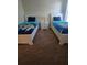 Shared ' bedroom with plush carpet, two beds with 'Toy Story' bedding, and a bedside table at 8923 Cuban Palm Rd, Kissimmee, FL 34747