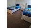 Shared ' bedroom with plush carpet, two beds with 'Toy Story' bedding, and a bedside table at 8923 Cuban Palm Rd, Kissimmee, FL 34747