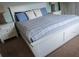 Primary bedroom with white furniture and plush carpeting at 8923 Cuban Palm Rd, Kissimmee, FL 34747