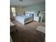 Bright bedroom with plush carpeting, great window light, and coordinated decor at 8923 Cuban Palm Rd, Kissimmee, FL 34747
