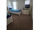 Shared ' bedroom with plush carpet, two beds with 'Toy Story' bedding, dresser, and a TV at 8923 Cuban Palm Rd, Kissimmee, FL 34747