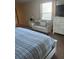 Bedroom with plush carpet, comfortable settee, and good natural light at 8923 Cuban Palm Rd, Kissimmee, FL 34747