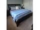 Cozy bedroom featuring plush carpet and a comfortable queen size bed at 8923 Cuban Palm Rd, Kissimmee, FL 34747