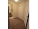 Inviting bedroom with neutral carpet, ample closet space, and access to a bathroom at 8923 Cuban Palm Rd, Kissimmee, FL 34747