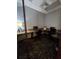 A modern business center features computers, granite counters, and comfortable seating at 8923 Cuban Palm Rd, Kissimmee, FL 34747