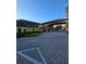 The community clubhouse features a covered entrance, ample parking and verdant landscaping at 8923 Cuban Palm Rd, Kissimmee, FL 34747