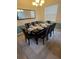 Formal dining room featuring a large dining table set for ten guests at 8923 Cuban Palm Rd, Kissimmee, FL 34747